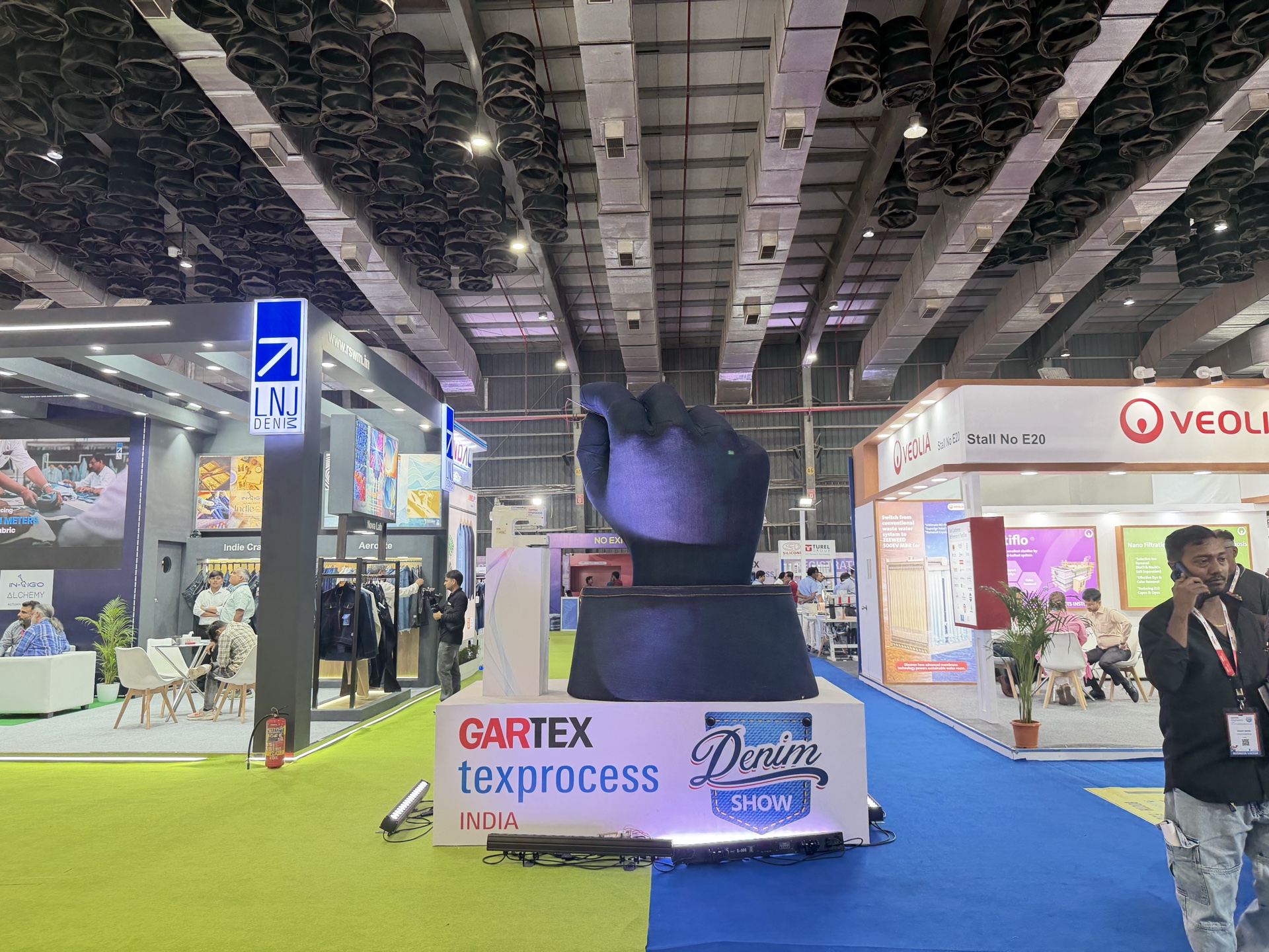 Gartex trade fair, India — large-scale carpet installation in progress